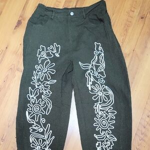 Green Pants with White Embroidery. Tag Says L, FITS MORE LIKE A MEDIUM.